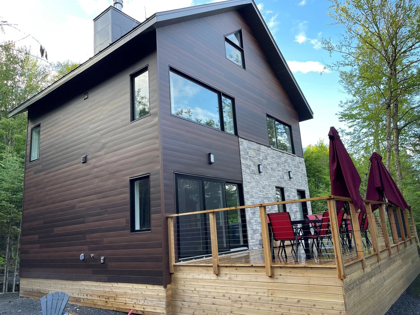 Exterior view of L’Évasion chalet in summer