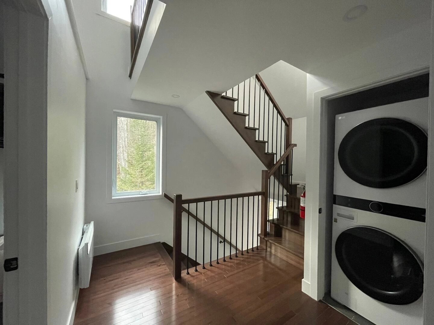 Upper hallway and laundry area of L’Évasion chalet