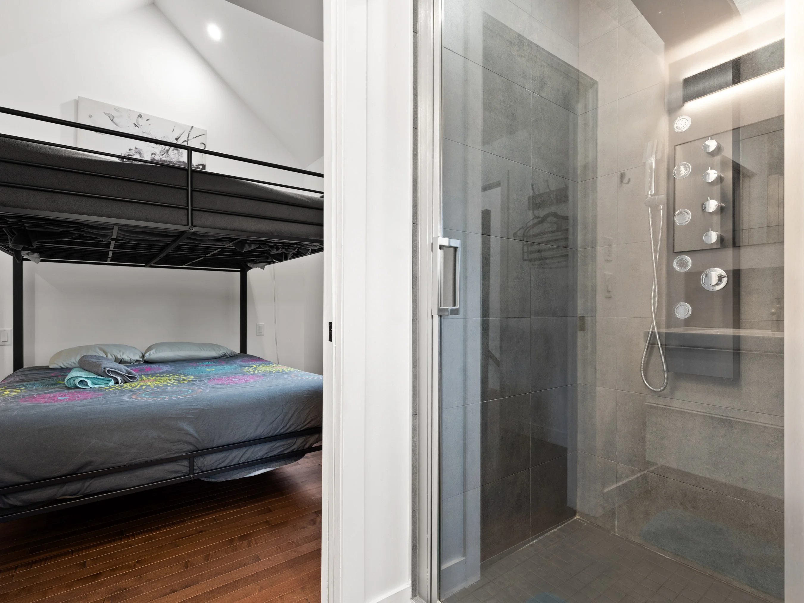 Shower room near the stacked queen beds at Le Céleste chalet